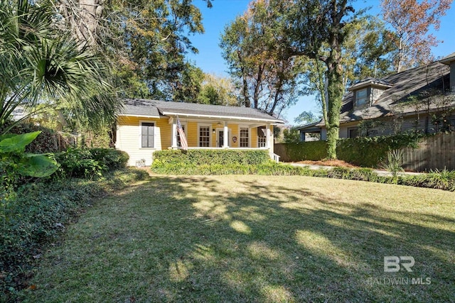 view of front of home with a porch and a front lawn