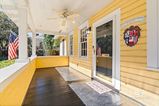 view of patio featuring ceiling fan and a porch