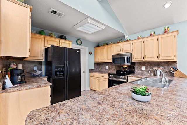 kitchen with visible vents, a sink, tasteful backsplash, appliances with stainless steel finishes, and light countertops