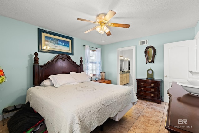 bedroom featuring visible vents, a textured ceiling, connected bathroom, light tile patterned floors, and ceiling fan