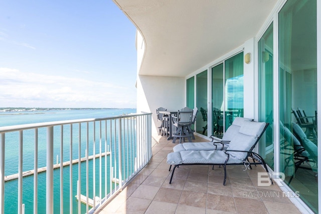 balcony featuring a water view