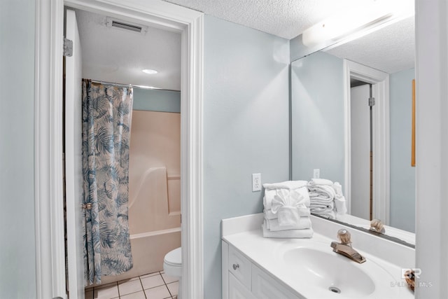 full bathroom with shower / bath combo, a textured ceiling, vanity, tile patterned flooring, and toilet