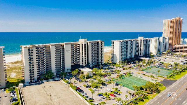 birds eye view of property featuring a water view and a view of the beach