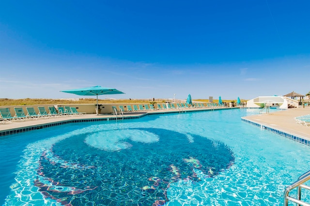 view of swimming pool with a patio area