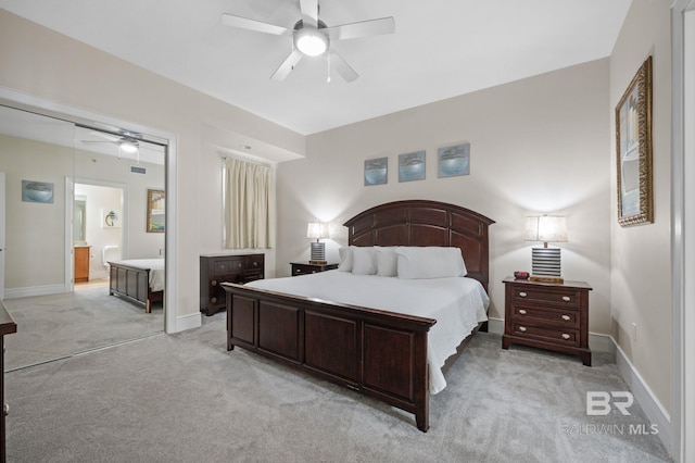 bedroom with baseboards, ceiling fan, visible vents, and light colored carpet