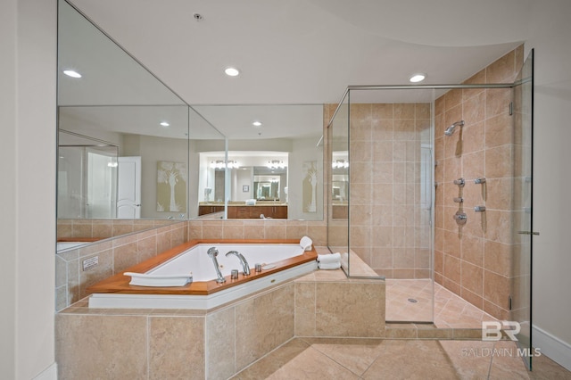 bathroom with tile patterned floors, a shower stall, a bath, and recessed lighting