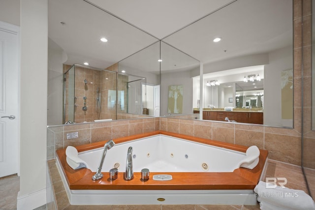 full bathroom with a stall shower, vanity, a whirlpool tub, and recessed lighting