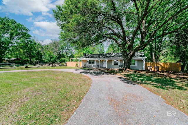 single story home with a front lawn and a porch