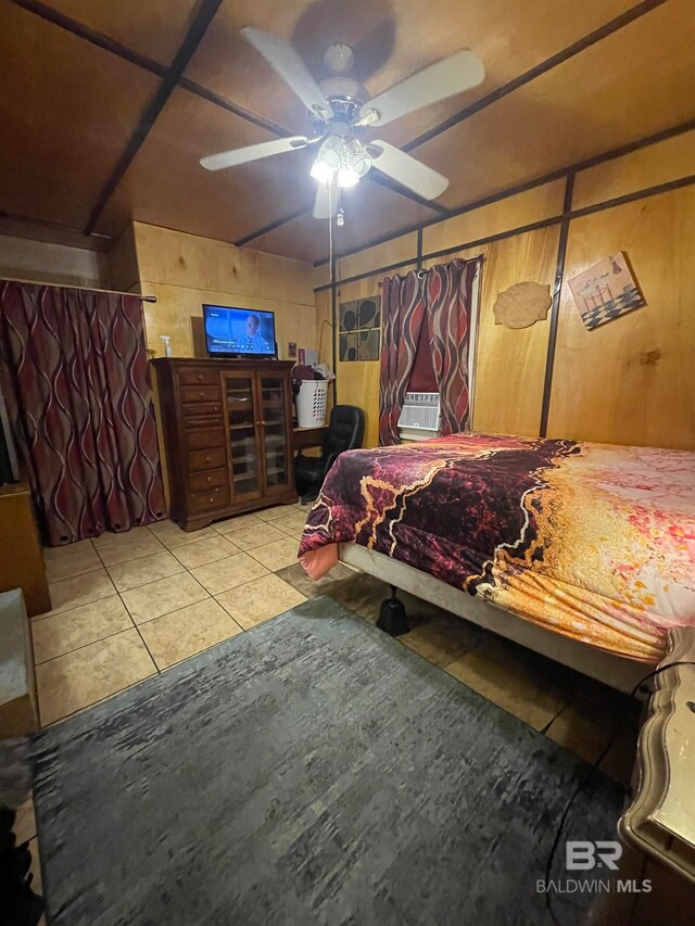 tiled bedroom featuring ceiling fan