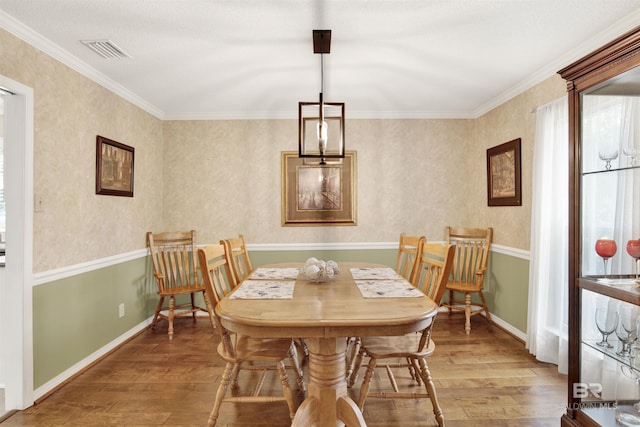 7431 Summer Ct, Mobile, AL 36695 - dining room with wood finished floors, healthy amount of natural light, crown molding, and baseboards