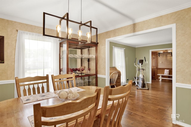 7431 Summer Ct, Mobile, AL 36695 - dining room with wood finished floors, a chandelier, and crown molding