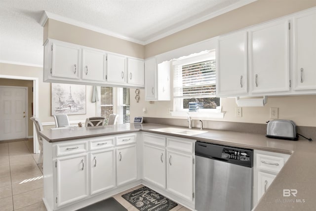 7431 Summer Ct, Mobile, AL 36695 - kitchen featuring dishwasher, a sink, white cabinets, a peninsula, and a textured ceiling