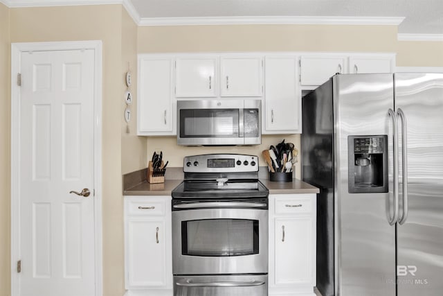 7431 Summer Ct, Mobile, AL 36695 - kitchen with stainless steel appliances, white cabinetry, crown molding, and dark countertops