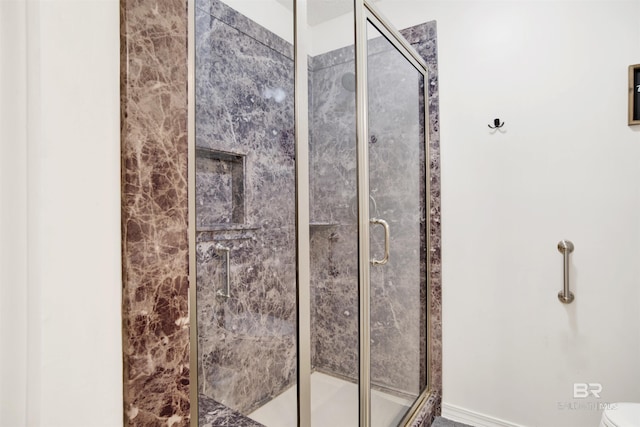 7431 Summer Ct, Mobile, AL 36695 - bathroom featuring a shower stall and toilet