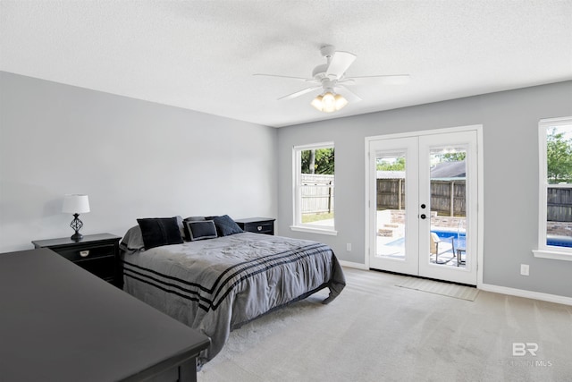 7431 Summer Ct, Mobile, AL 36695 - bedroom with access to outside, french doors, light colored carpet, baseboards, and a textured ceiling