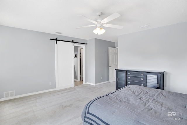 7431 Summer Ct, Mobile, AL 36695 - bedroom featuring a barn door, carpet floors, baseboards, and ceiling fan