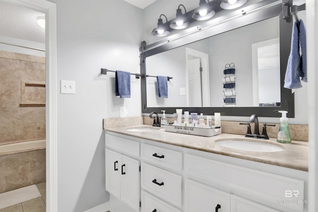 7431 Summer Ct, Mobile, AL 36695 - bathroom featuring double vanity, tile patterned floors, and tiled shower