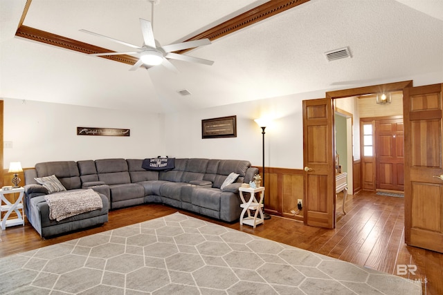 7431 Summer Ct, Mobile, AL 36695 - living room featuring wood finished floors, a ceiling fan, vaulted ceiling, wainscoting, and wooden walls