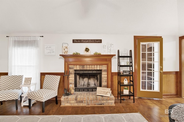 7431 Summer Ct, Mobile, AL 36695 - sitting room featuring wood finished floors, wainscoting, and a fireplace