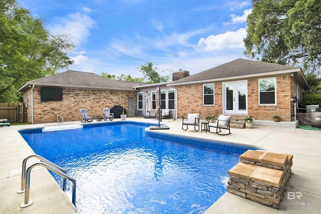 7431 Summer Ct, Mobile, AL 36695 - view of swimming pool featuring french doors, a patio area, and fence