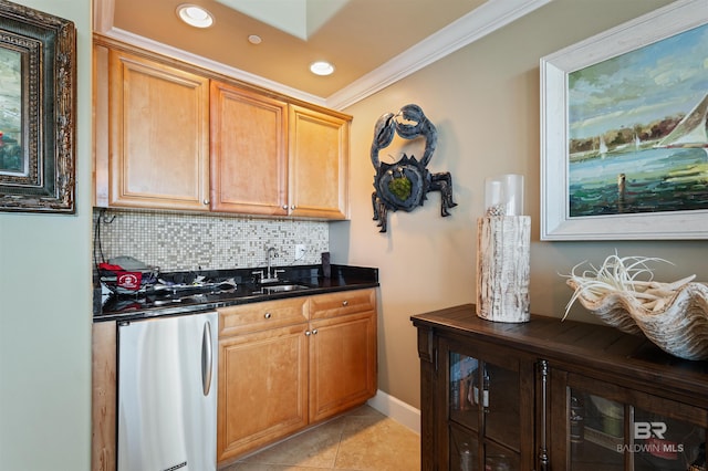 kitchen featuring a sink, backsplash, fridge, crown molding, and light tile patterned floors