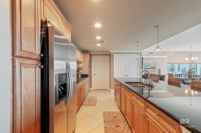 kitchen featuring a sink, decorative light fixtures, recessed lighting, stainless steel appliances, and light tile patterned floors