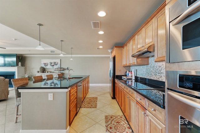 kitchen with visible vents, under cabinet range hood, a breakfast bar, appliances with stainless steel finishes, and a sink