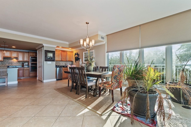 dining area with light tile patterned floors, visible vents, crown molding, and a notable chandelier