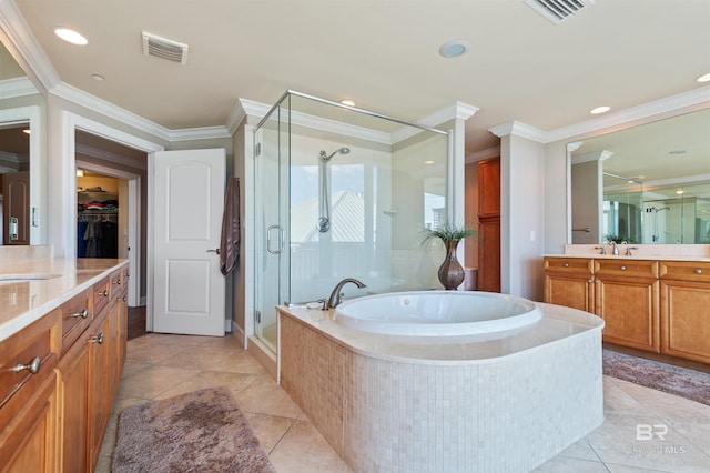 bathroom featuring visible vents, a shower stall, crown molding, a garden tub, and vanity