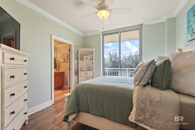 bedroom with dark wood-style floors, connected bathroom, crown molding, baseboards, and access to exterior