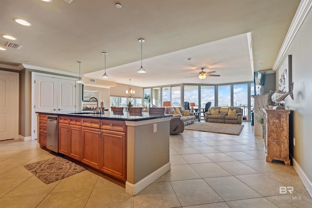 kitchen with visible vents, ornamental molding, a sink, dark countertops, and brown cabinetry