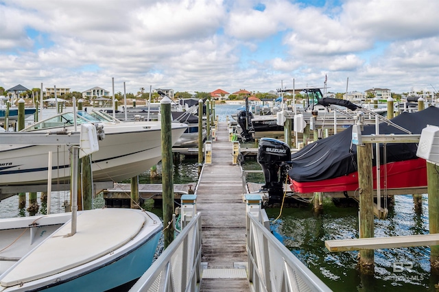 dock area with a water view and boat lift