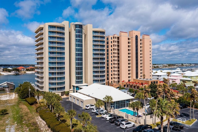 view of building exterior featuring uncovered parking