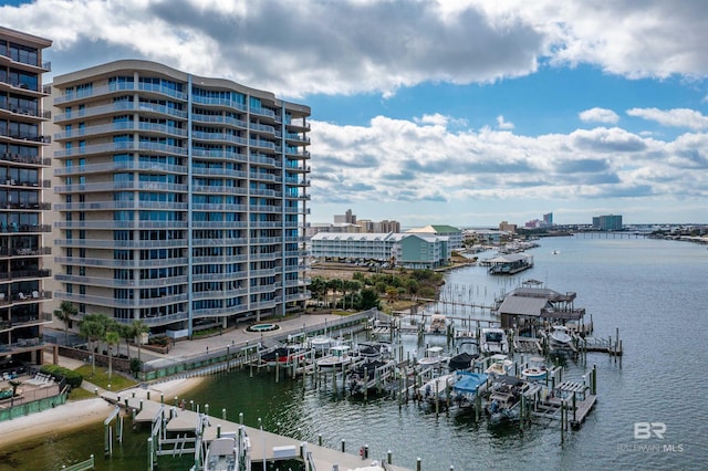 view of water feature with a view of city, boat lift, and a boat dock