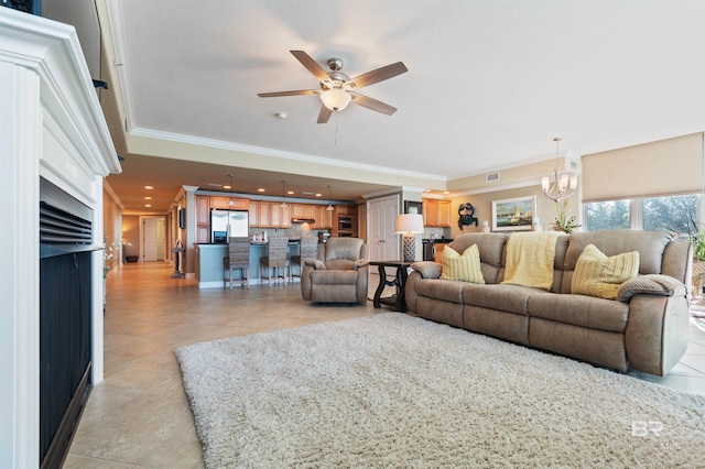 living room featuring visible vents, ceiling fan with notable chandelier, recessed lighting, light tile patterned flooring, and crown molding