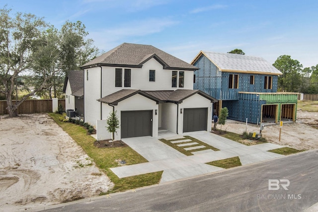 845 Inlet Cir, Gulf Shores, AL 36542 - view of front of property featuring a garage, stucco siding, driveway, and a shingled roof