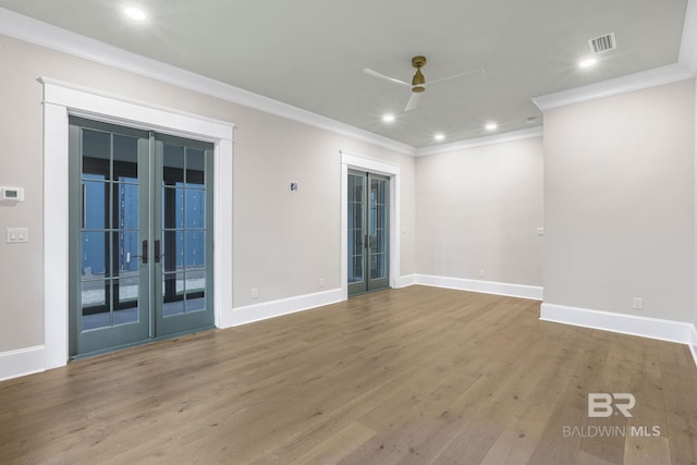 845 Inlet Cir, Gulf Shores, AL 36542 - spare room with french doors, crown molding, ceiling fan, recessed lighting, and wood finished floors