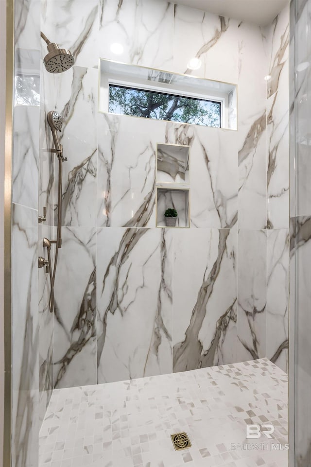 845 Inlet Cir, Gulf Shores, AL 36542 - bathroom featuring a marble finish shower and plenty of natural light