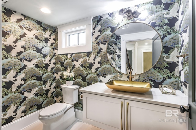 845 Inlet Cir, Gulf Shores, AL 36542 - bathroom featuring wallpapered walls, vanity, and ornamental molding