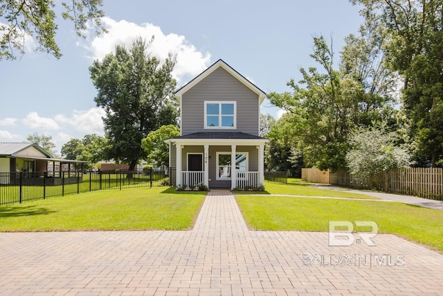 exterior space featuring covered porch and a yard