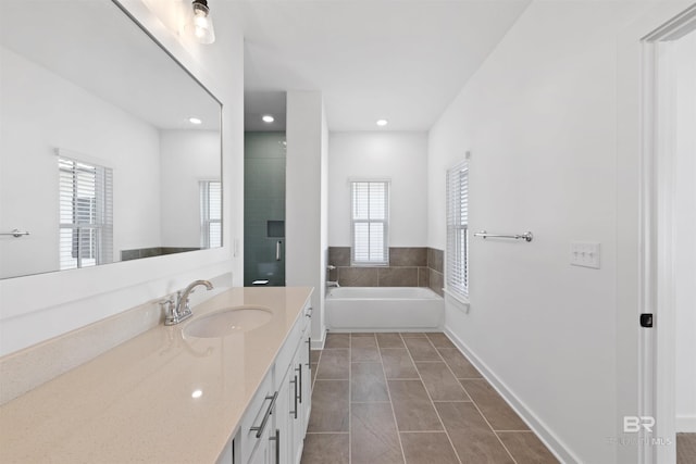 4669 Casablanca Dr, Orange Beach, AL 36561 - full bath featuring recessed lighting, vanity, a bath, a shower stall, and tile patterned flooring
