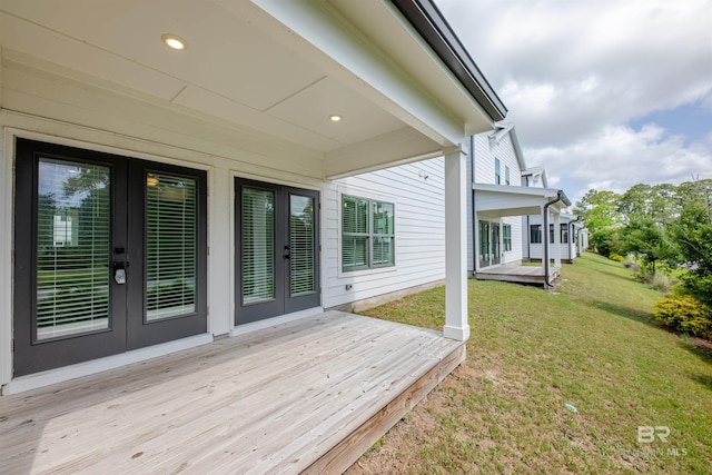 4669 Casablanca Dr, Orange Beach, AL 36561 - deck with french doors and a lawn