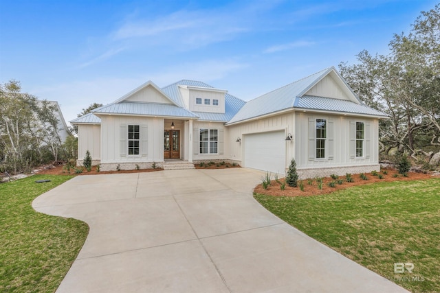 modern inspired farmhouse with board and batten siding, a front lawn, metal roof, and a garage