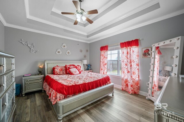 1206 Crown Walk Dr, Foley, AL 36535 - bedroom with crown molding, hardwood / wood-style flooring, a raised ceiling, and ceiling fan