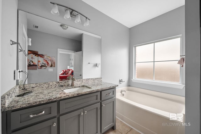 1206 Crown Walk Dr, Foley, AL 36535 - bathroom with vanity, tile patterned flooring, and a bathtub
