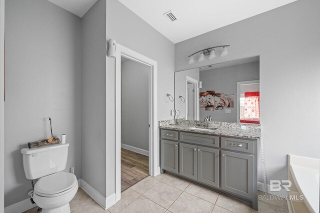 1206 Crown Walk Dr, Foley, AL 36535 - bathroom with tile patterned flooring, vanity, and toilet