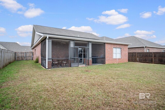 1206 Crown Walk Dr, Foley, AL 36535 - rear view of property featuring a sunroom and a lawn