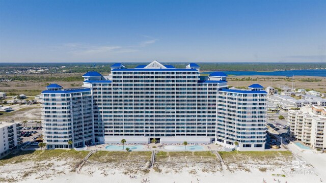 aerial view featuring a view of the beach and a water view