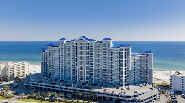 aerial view featuring a view of the beach and a water view