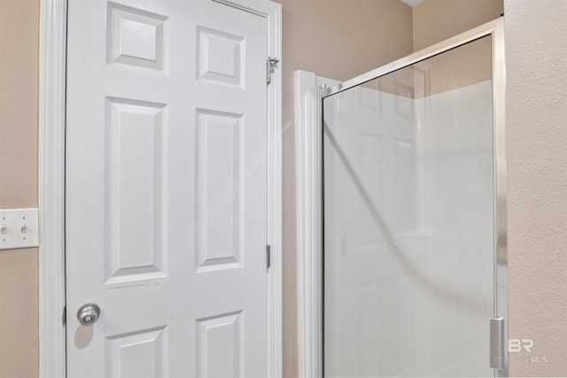 full bathroom featuring a stall shower